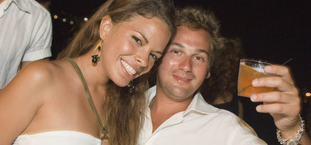 A man salutes to his pretty date on the dance cruise.