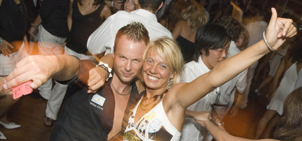 A couple is caught taking a selfie on the dance cruise.