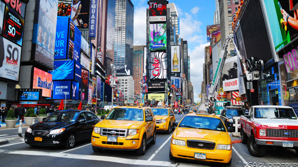 The bus tour takes you through Time Square in NYC.