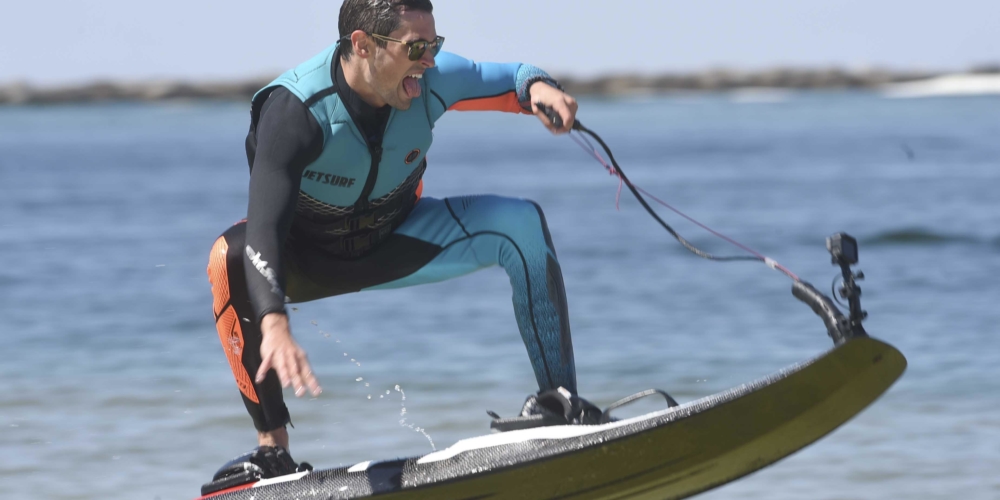 Man rides a netsurf in Destin florida while using a gopro to film his experience.