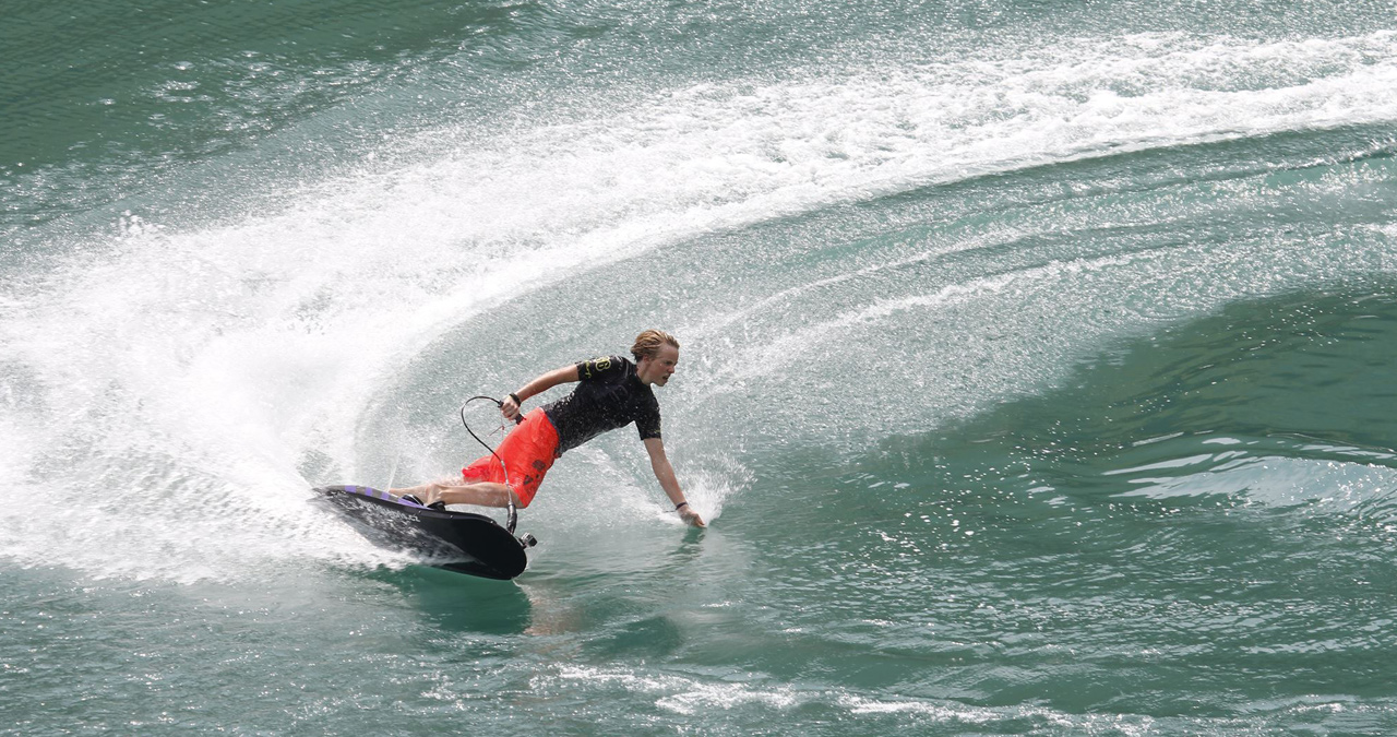 A young kid shreds on his Jetsurf