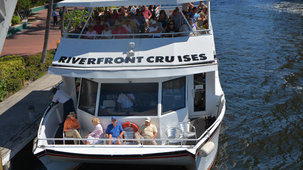 A private group takes a sightseeing cruise along the New River in Fort Lauderdale.