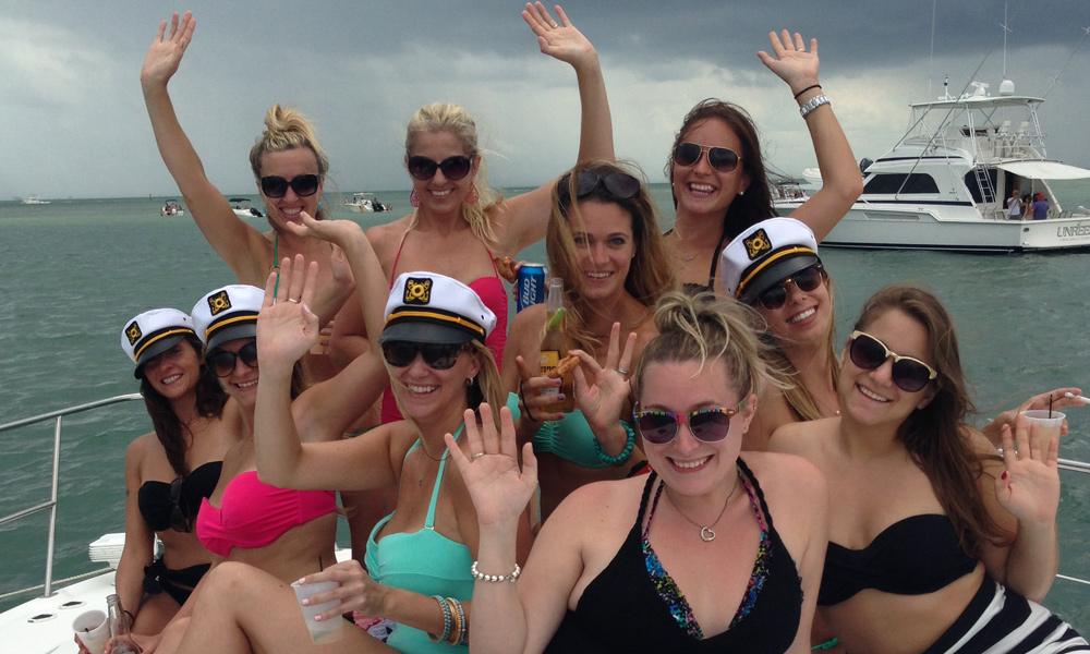 A group of ladies pose for a picture on the White Ice yacht in Miami.