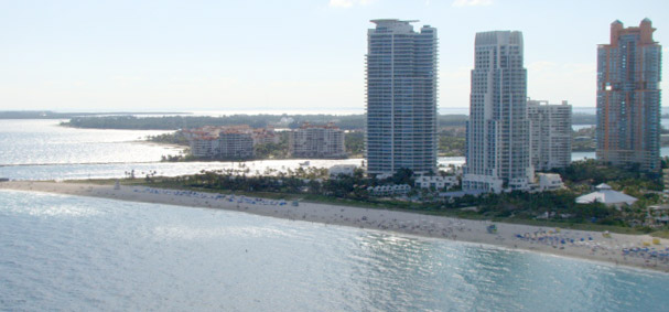 A day at the beach is made incredible by taking a parasailing adventure over Miami Beach.