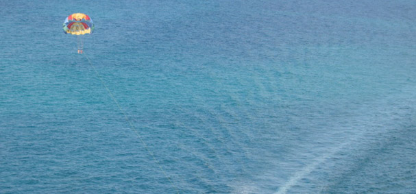 Just you and the big blue ocean on a parasailing trip in Miami.