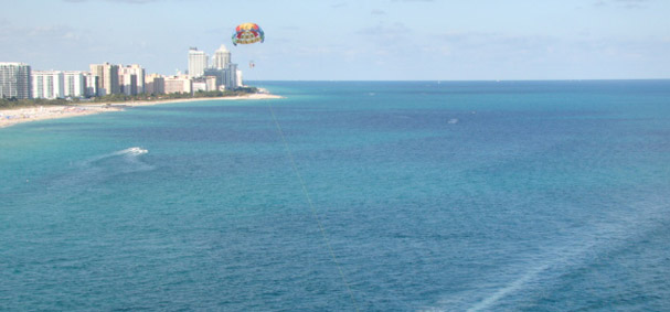 Soar high above the sea to capture scenic shots of Miami Beach with Downtown Miami in the background.